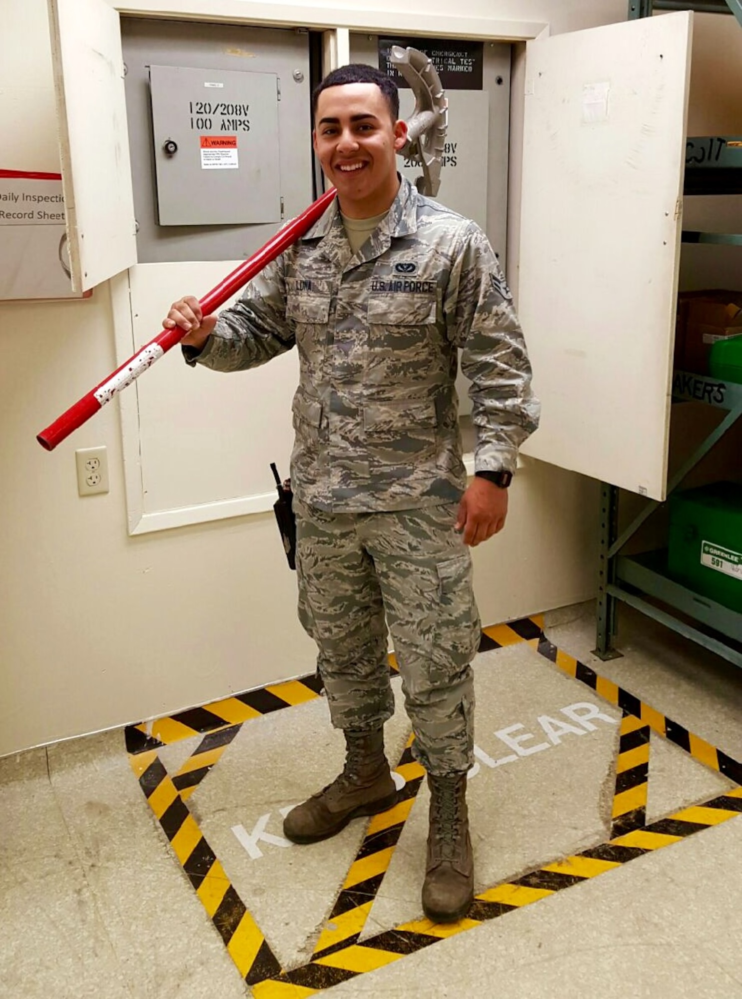 Airman 1st Class Luis Luna, 60th Civil Engineer Squadron electrical systems journeyman, poses for a photo at Travis Air Force Base, Calif., July 27, 2016. Working within the fire alarm shop, Luna performs preventative maintenance inspections on more than 250 fire alarm systems supporting three airframes and partner units on the installation. (Courtesy photo)