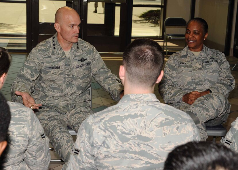 Gen. Carlton D. Everhart II, Air Mobility Command commander, left, and Chief Master Sgt. Shelina Frey, Air Mobility Command command chief, speak with Airmen July 28, 2016, on Grand Forks Air Force Base, N.D. Everhart and Frey toured the dorms and spoke with Airmen about their concerns and hopes for the base and the future of the U.S. Air Force. (U.S. Air Force photo by Senior Airman Ryan Sparks/Released)