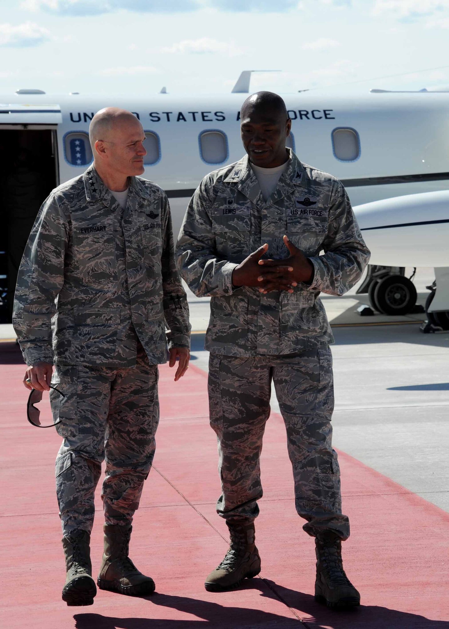 Gen. Carlton D. Everhart II, Air Mobility Command commander, left, is greeted by Col. Rodney Lewis, 319th Air Base Wing commander, July 27, 2016, on Grand Forks Air Force Base, N.D.  Everhart and Chief Master Sgt. Shelina Frey, Air Mobility Command command chief, visited Grand Forks AFB to check on the well-being of Airmen and the mission. (U.S. Air Force photo by Senior Airman Ryan Sparks/Released)