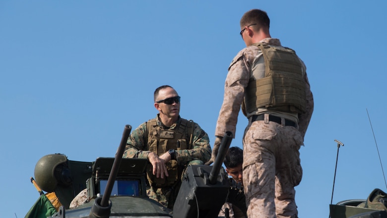 Maj. Gen. John K. Love, 2nd Marine Division commanding general, speaks with Marines before conducting a live-fire gunnery range at Marine Corps Base Camp Lejeune, North Carolina, July 27, 2016. Marines with 2nd Assault Amphibian Battalion spent the day refining their marksmanship skill as individuals and their ability to work as an AAV crew.