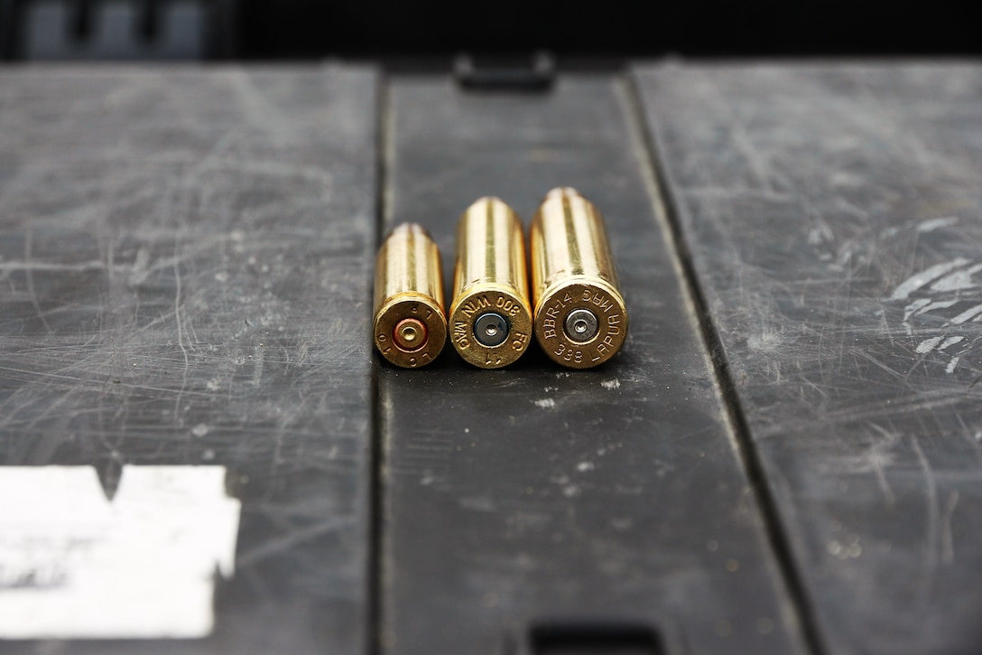 Marine Corps Systems Command’s Infantry Weapons Systems conducted a market research caliber study July 13, at Fort A.P. Hill, Va., to inform Marine Corps acquisition leaders about future Marine sniper weapon system requirements. During the study, IWS collected ballistic data on three different caliber bullets (from left)—the 7.62mm NATO, .300 Winchester Magnum,  and .338 Lapua Magnum—fired by Marine Corps snipers using different rifles at distances ranging from 900 to 1,500 meters to target. (U.S. Marine Corps photo by Ashley Calingo) 