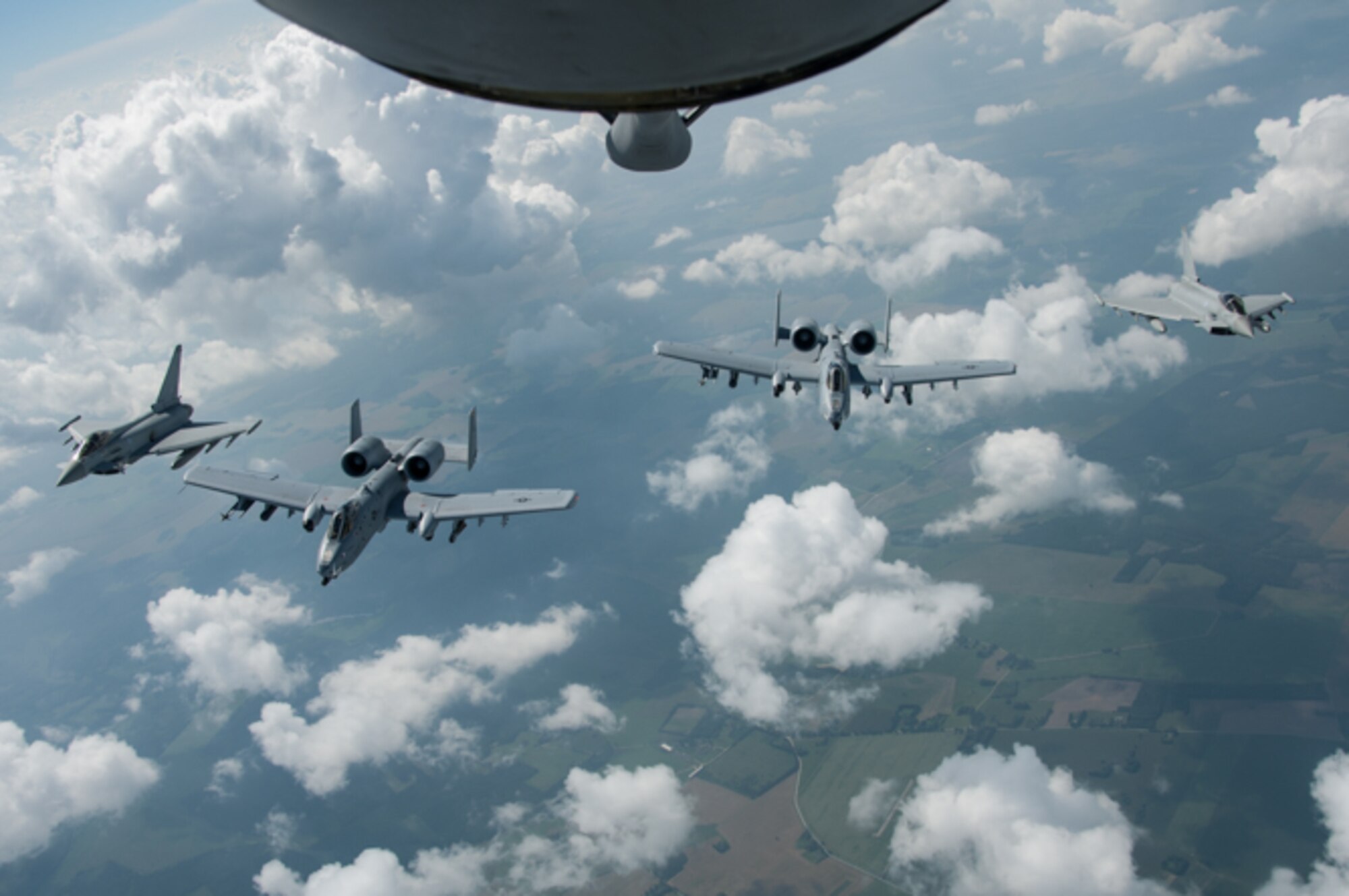 Two U.S. Air Force A-10 Thunderbolt IIs assigned to the 442nd Fighter Wing, Whiteman Air Force Base, Missouri, align with two Royal Air Force Eurofighter Typhoons during dissimilar aircraft training at Ämari Air Base, Estonia, July 28, 2016. This training is in supporting of Operation Atlantic Resolve which aims to demonstrate  the commitment the U.S. has made to the security of Estonia and other NATO allies. (U.S. Air Force photo by Senior Airman Missy Sterling/released)
