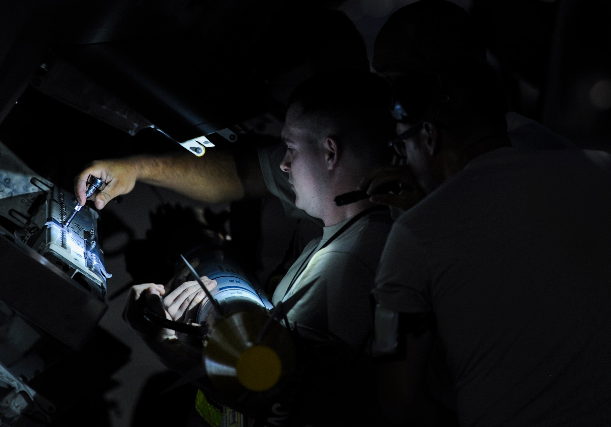 Maintainers, assigned to the 27th Fighter Squadron, Joint Base Langley-Eustis, Va., load an F-22A Raptor prior to take-off during Red Flag 16-3 at Nellis Air Force Base, Nev., July 25, 2016. Red Flag is a realistic combat training exercise involving the air, space and cyber forces of the U.S. (U.S. Air Force photo by Airman 1st Class Kevin Tanenbaum/Released)