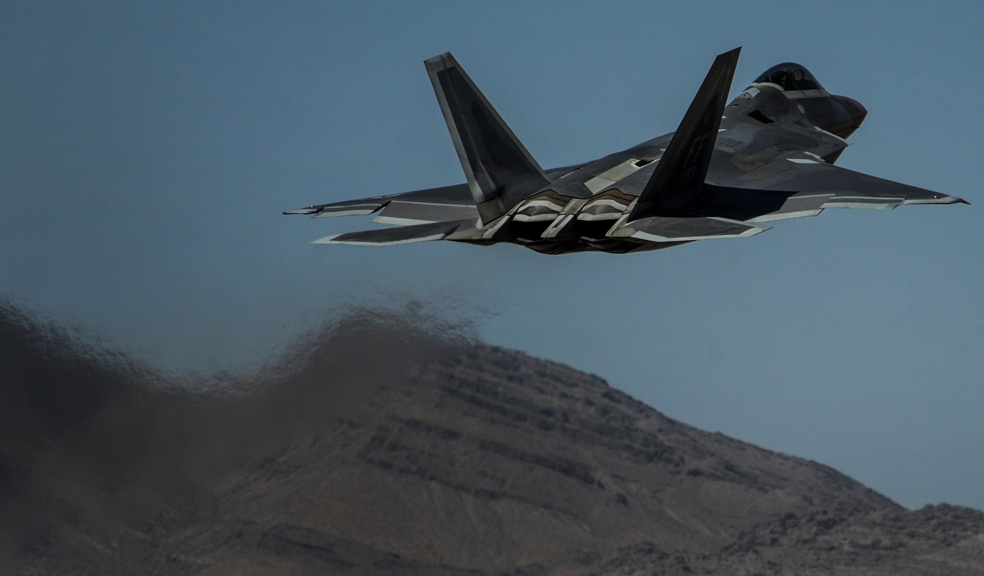 An F-22A Raptor, assigned to the 27th Fighter Squadron, Joint Base Langley-Eustis, Va., takes off during the operations of Red Flag 16-3, July 11, 2016. Aircraft and personnel deploy to Nellis AFB for Red Flag under Air Expeditionary Force concept and make up the exercise’s “blue” forces. (U.S. Air Force photo by Airman 1st Class Kevin Tanenbaum/Released)