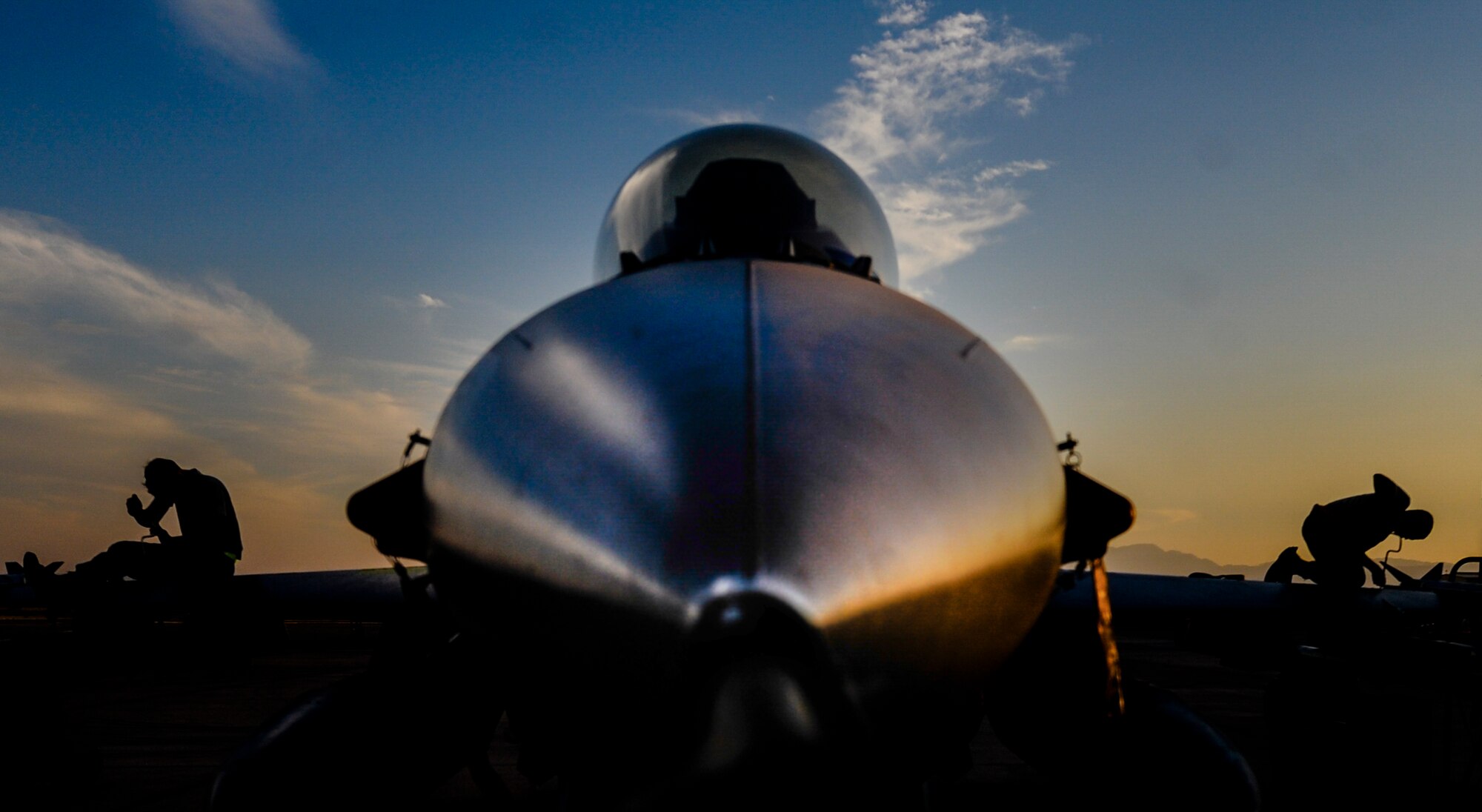 Maintainers assigned to the 79th Fighter Squadron, Shaw Air Force Base, S.C., work on an F-16CJ during Red Flag 16-3 at Nellis Air Force Base, Nev., July 25, 2016. Red Flag provides a series of intense air-to-air scenarios for aircrew and ground personnel which will increase their combat readiness and effectiveness for future real world missions. (U.S. Air Force photo by Airman 1st Class Kevin Tanenbaum/Released)