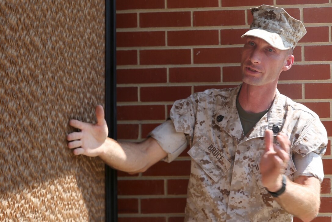 Staff Sgt. Mark Bruce, engineer chief with Chemical Biological Incident Response Force, explains how a portable cooler uses large coils soaked in water and a fan to create cool air at the local chow hall aboard Naval Support Facility Indian Head, Md., July 22, 2016. The event provided the Marines with the CBIRF engineer platoon hands-on training further sharpening their skills for expeditionary operations. (Official Marine Corps photo by Sgt. Jonathan S. Herrera/Released) 
