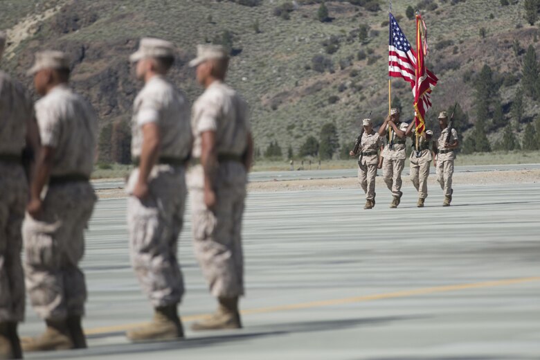 The Marine Corps Mountain Warfare Training Center Color Guard marches on the colors during the MCMWTC’s change of command ceremony at the expeditionary airfield, July 22, 2016. During the ceremony, Col. Scott D. Leonard, outgoing commanding officer, MCMWTC, relinquished command to Col. James E. Donnellan, oncoming commanding officer, MCMWTC. (Official Marine Corps photo by Cpl. Medina Ayala-Lo/Released)