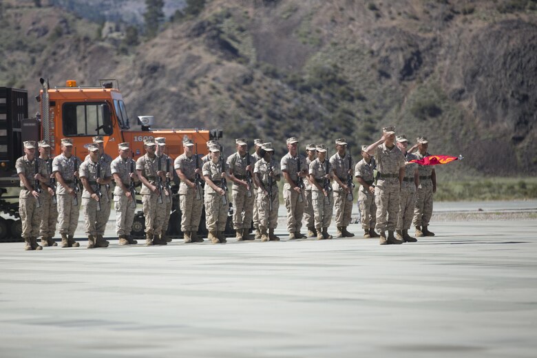 Marines with Marine Corps Mountain Warfare Training Center perform a rifle salute during the MCMWTC’s change of command ceremony at the expeditionary airfield, July 22, 2016. During the ceremony, Col. Scott D. Leonard, outgoing commanding officer, MCMWTC, relinquished command to Col. James E. Donnellan, oncoming commanding officer, MCMWTC. (Official Marine Corps photo by Cpl. Medina Ayala-Lo/Released)