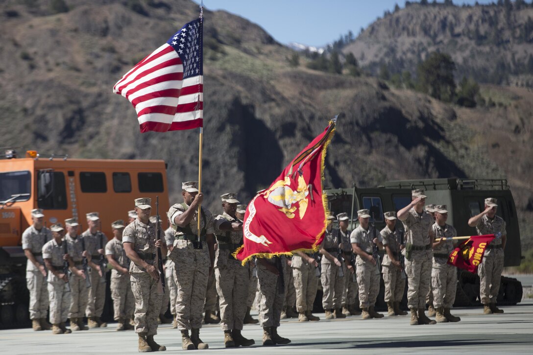 The Marine Corps Mountain Warfare Training Center Color Guard presents the colors during the MCMWTC’s change of command ceremony at the expeditionary airfield, July 22, 2016. During the ceremony, Col. Scott D. Leonard, outgoing commanding officer, MCMWTC, relinquished command to Col. James E. Donnellan, oncoming commanding officer, MCMWTC. (Official Marine Corps photo by Cpl. Medina Ayala-Lo/Released)