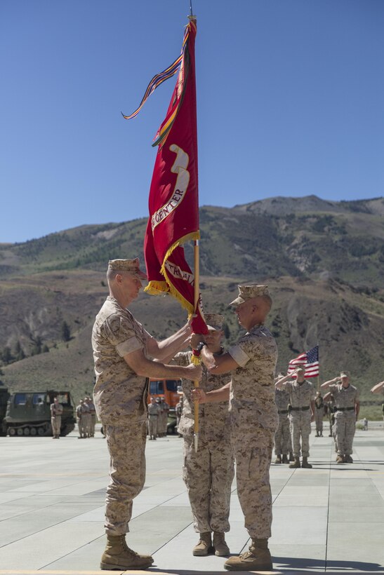 Colonel Scott D. Leonard, outgoing commanding officer, Marine Corps Mountain Warfare Training Center, relinquishes command to Col. James E. Donnellan, oncoming commanding officer, MCMWTC, during the change of command ceremony at the expeditionary airfield, July 22, 2016. (Official Marine Corps photo by Cpl. Medina Ayala-Lo/Released)