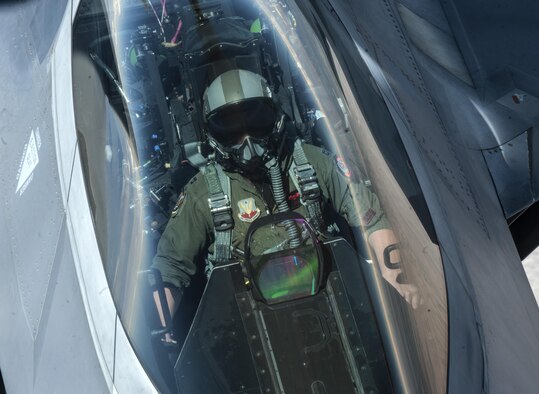 An F-22A Raptor pilot assigned to the 27th Fighter Squadron, Joint Base Langley-Eustis, Virginia, holds a steady aerial refueling position beneath a KC-135 Stratotanker during a Red Flag 16-3 training sortie July 22, 2016 at Nellis AFB, Nev. Just northwest of Nellis AFB lies the 2.9 million-square-acre Nevada test and Training Range which provides a realistic arena for operational testing and training aircrews to improve combat readiness. (U.S. Air Force photo by Senior Airman Joshua Kleinholz)