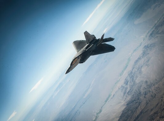 An F-22A Raptor assigned to the 27th Fighter Squadron, Joint Base Langley-Eustis, Virginia, holds pattern and awaits a wingman conducting an aerial refuel during a Red Flag 16-3 training sortie July 22, 2016 at Nellis AFB, Nev.  Various units from around the Air Force, joint branches and coalition partners converge on Nellis three to four times a year to take part in the exercise, which puts to test the participant force’s air, space, cyber and combat search and rescue capabilities. (U.S. Air Force photo by Senior Airman Joshua Kleinholz)