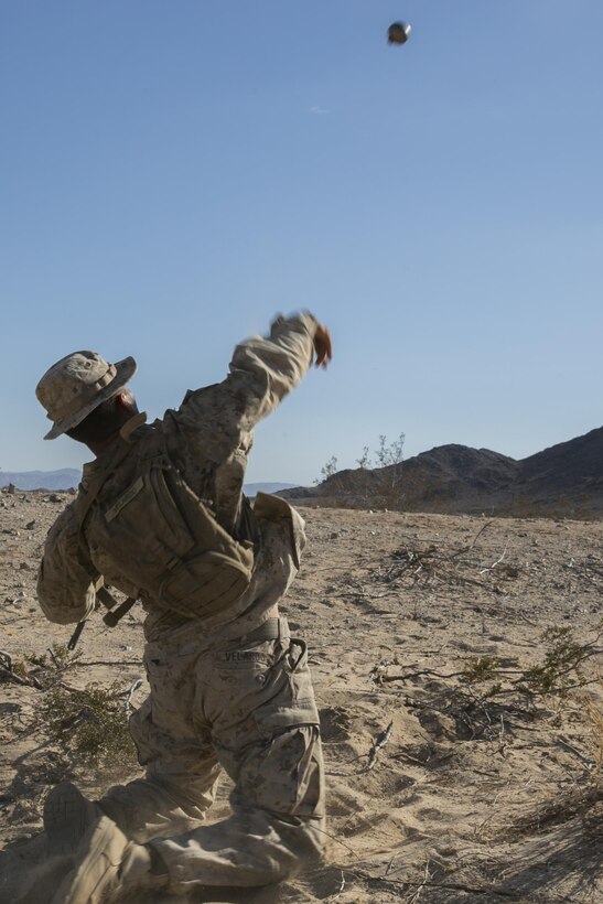 Pfc. Jurel Velardo, team leader, 3rd Battalion, 4th Marines, 7th Marine Regiment, throws an inert fragmentation grenade during a non-live-fire exercise as part of Tactical Small-Unit Leadership Course aboard Marine Corps Air Ground Combat Center, Twentynine Palms, Calif., July 17, 2016. The purpose of the course was to focus on the training of small-unit leadership within “Darkside.” (Official Marine Corps photo by Lance Cpl. Dave Flores/Released)