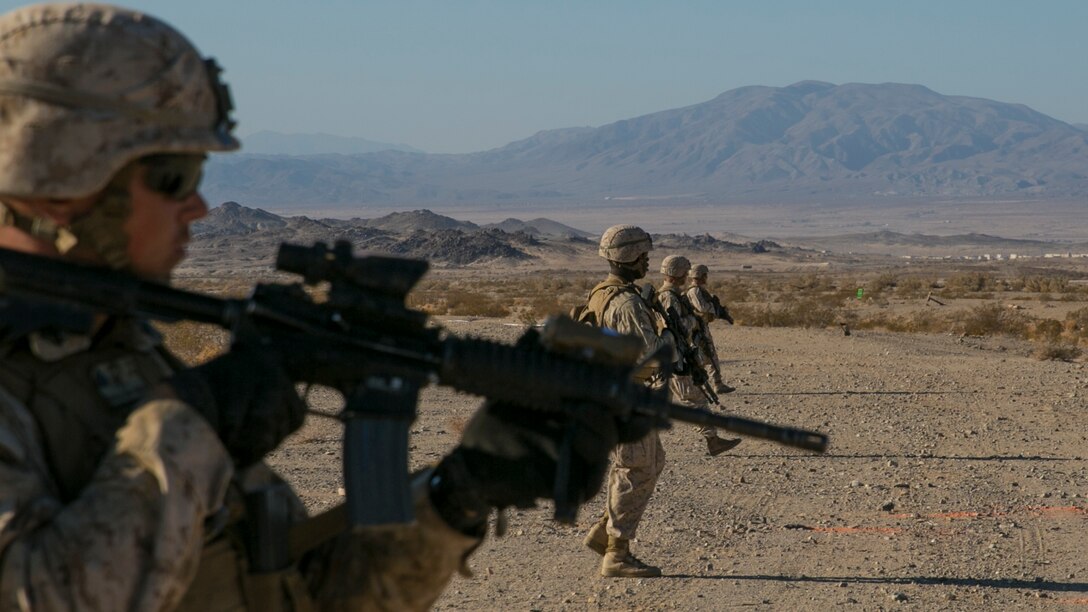 Marines with 3rd Battalion, 4th Marines, 7th Marine Regiment, proceed in a skirmisher formation at the beginning of a live-fire exercise as part of Tactical Small-Unit Leadership Course aboard Marine Corps Air Ground Combat Center, Twentynine Palms, Calif., July 18, 2016. The purpose of the course was to focus on the training of small-unit leadership within “Darkside.” (Official Marine Corps photo by Lance Cpl. Dave Flores/Released)