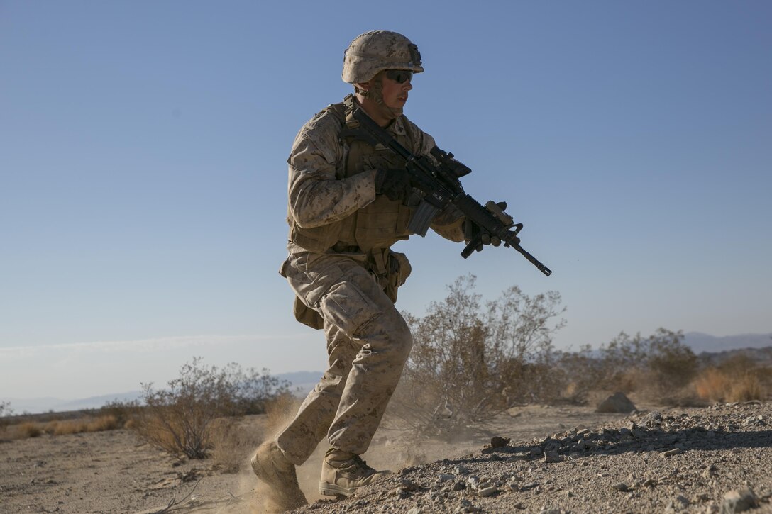 Cpl. Reid Ohala, team leader, 3rd Battalion, 4th Marines, 7th Marine Regiment, advances during a live-fire exercise as part of Tactical Small-Unit Leadership Course aboard Marine Corps Air Ground Combat Center, Twentynine Palms, Calif., July 18, 2016. The purpose of the course was to focus on the training of small-unit leadership within “Darkside.” (Official Marine Corps photo by Lance Cpl. Dave Flores/Released)