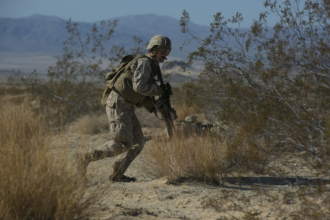 Cpl. Shane Martin, team leader, 3rd Battalion, 4th Marines, 7th Marine Regiment, advances during a fire team live-fire exercise as part of Tactical Small-Unit Leadership Course aboard Marine Corps Air Ground Combat Center, Calif. July 18, 2016. The purpose of the course was to focus on the training of small-unit leadership within “Darkside.” (Official Marine Corps photo by Lance Cpl. Dave Flores/Released)