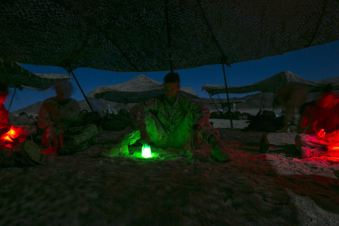 2nd Lt. Zachary Standeford, platoon commander, 3rd Battalion, 4th Marines, 7th Marine Regiment, reviews the performance of his squad in the nighttime live-fire exercises as part of Tactical Small-Unit Leadership Course aboard Marine Corps Air Ground Combat Center, Twentynine Palms, Calif., July 18, 2016. The purpose of the course was to focus on the training of small-unit leadership within “Darkside.” (Official Marine Corps photo by Lance Cpl. Dave Flores/Released)