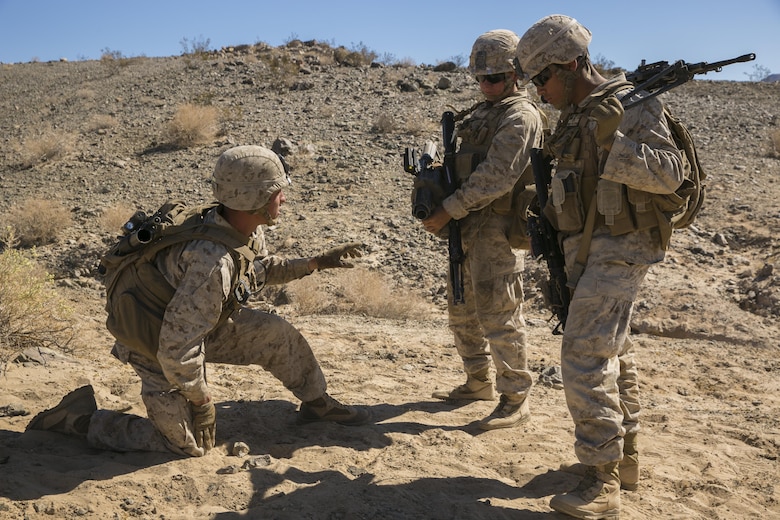 Cpl. Shane Martin, team leader, 3rd Battalion, 4th Marines, 7th Marine Regiment, briefs the members of his fire team as part of Tactical Small-Unit Leadership Course aboard Marine Corps Air Ground Combat Center, Twentynine Palms, Calif., July 18, 2016. The purpose of the course was to focus on the training of small-unit leadership within “Darkside.” (Official Marine Corps photo by Lance Cpl. Dave Flores/Released)