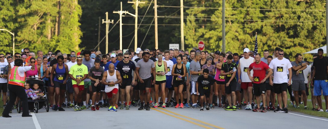Runners prepare to start the 7.5K Anniversary Run aboard Marine Corps Air Station Cherry Point, N.C., July 29, 2016. The run was to celebrate the 75th anniversary of MCAS Cherry Point and 2nd Marine Aircraft Wing. (Marine Corps photo by Lance Cpl. Cody Lemons/ Released)