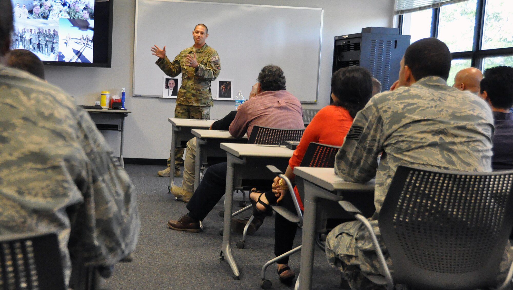 Fresh off a year-long deployment as an air advisor, Lt. Col. Mike Morales relays the lessons he learned to students at the Air Advisor Flight of the Expeditionary Operations School at Joint Base McGuire-Dix-Lakehurst, New Jersey, July 27. The school's staff also attended the presentation so they could ensure their lesson accurately reflect the current deployed environment. (U.S. Air Force photo by Senior Master Sgt. Shawn J. Jones)