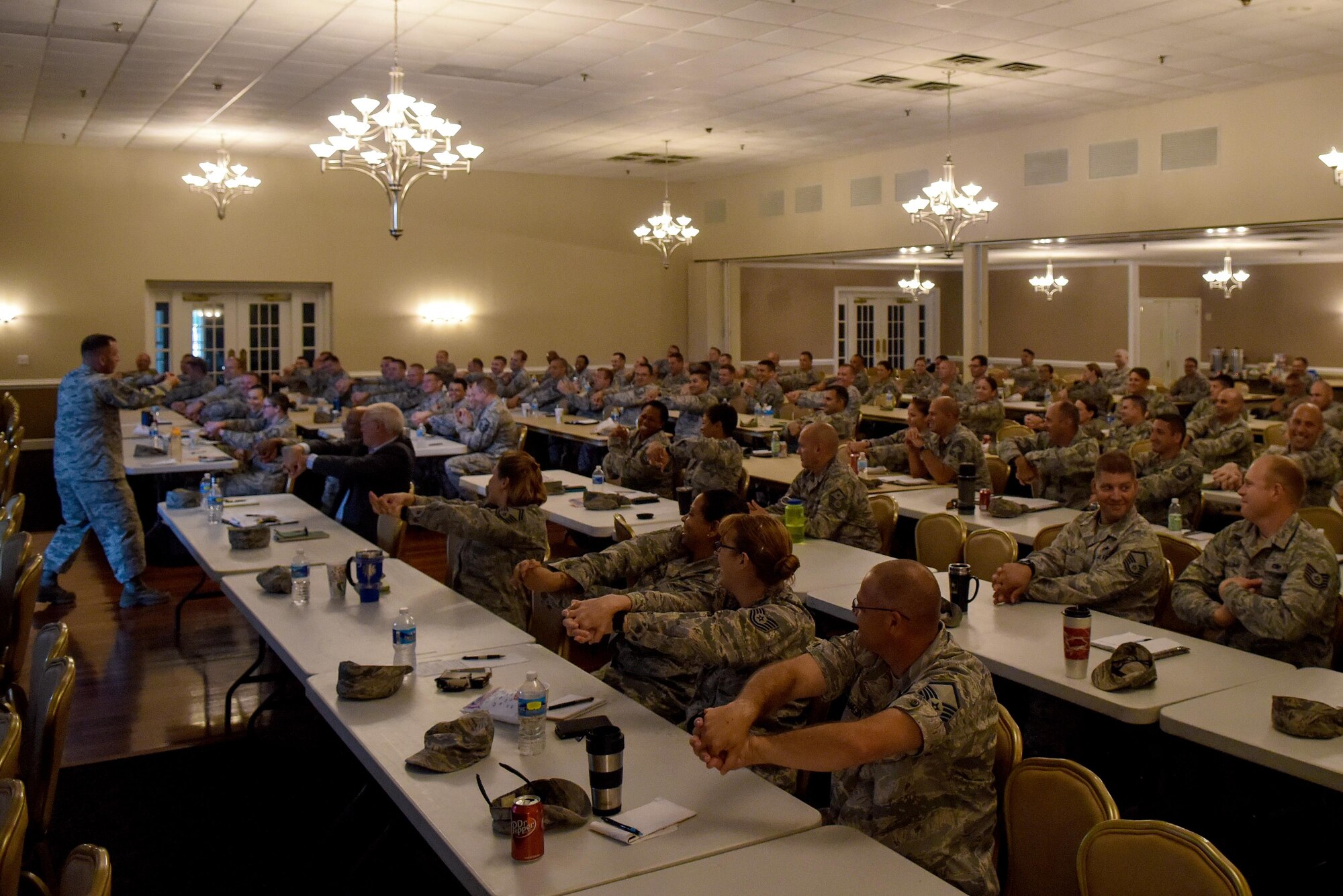Chief Master Sgt. Anthony Fisher, Profession of Arms Center of Excellence superintendent, leads more than 95 Senior NCOs in an exercise during an “Enhancing Human Capital” seminar, July 27, 2016, at Seymour Johnson Air Force Base, North Carolina. This seminar focused on reaching Air Force leaders within the SNCO tier and covered different types of learning, the affective leadership approach, active listening, and effective communication in an attempt to provide a better understanding of how professionalism drives individual behavior. (U.S. Air Force photo by Airman Shawna L. Keyes)