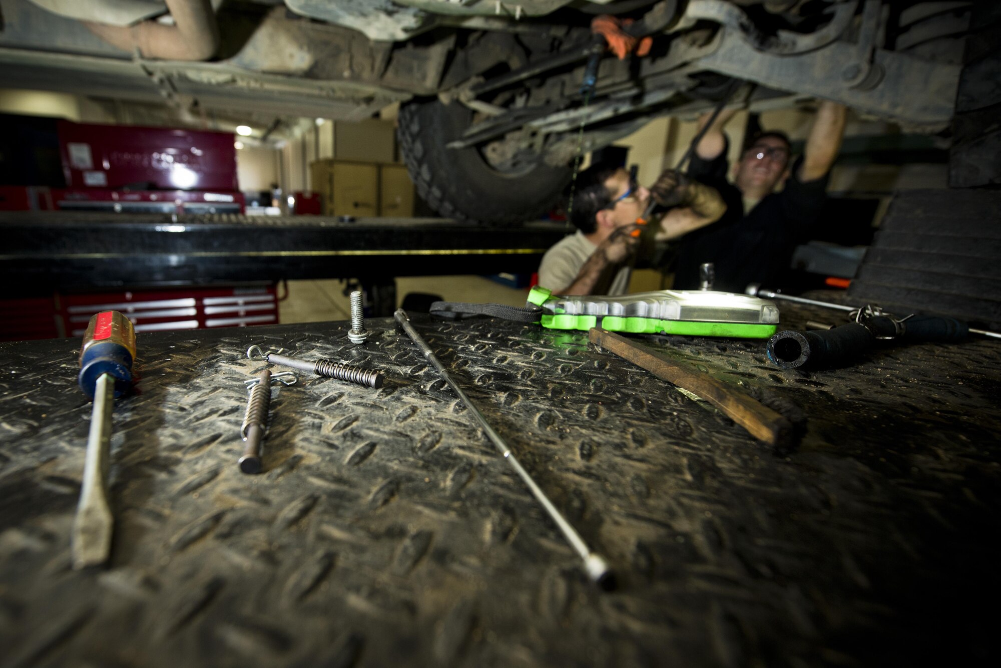 Various tools rest on a vehicle lift at the Defender Dome at Minot Air Force Base, N.D., July 28, 2016. The 91st Security Support Squadron is specifically responsible for preventative maintenance inspections and troubleshooting, and everything from electrical repair to transmission replacement, on armored Humvees and Bearcats. (U.S. Air Force photos/Airman 1st Class J.T. Armstrong)