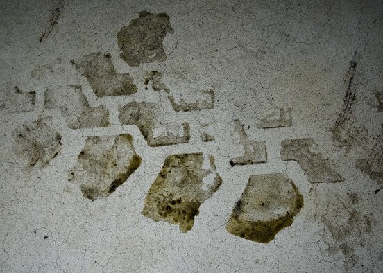 Vehicle treads mark the floor inside the Defender Dome at Minot Air Force Base, N.D., July 28, 2016. The 91st Security Support Squadron is specifically responsible for preventative maintenance inspections and troubleshooting, and everything from electrical repair to transmission replacement, on armored Humvees and Bearcats. (U.S. Air Force photos/Airman 1st Class J.T. Armstrong)