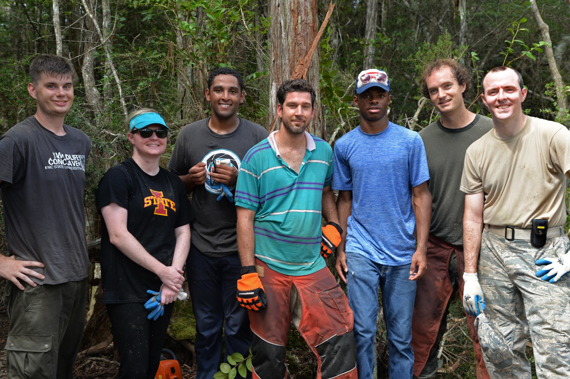 Volunteers for the reticulated flatwoods salamander habitat restoration project finish clearing away shrubbery at Hurlburt Field, Fla., July 28, 2016. Approximately 23 acres of habitat will be improved for the endangered species through 1st Special Operations Civil Engineering Squadron projects. (Courtesy photo)