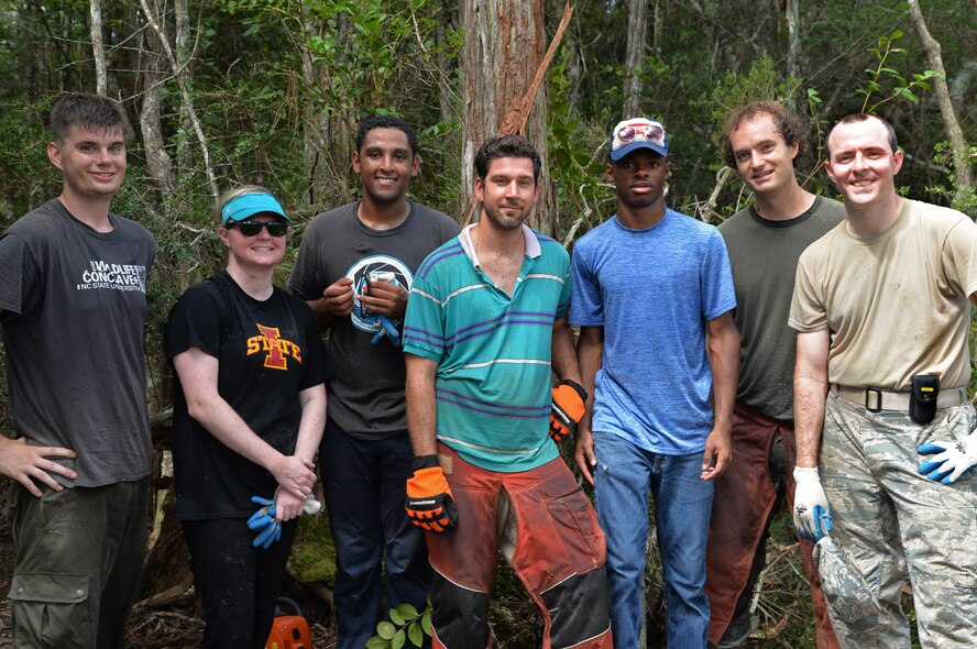 Volunteers for the reticulated flatwoods salamander habitat restoration project finish clearing away shrubbery at Hurlburt Field, Fla., July 28, 2016. Approximately 23 acres of habitat will be improved for the endangered species through 1st Special Operations Civil Engineering Squadron projects. (Courtesy photo)