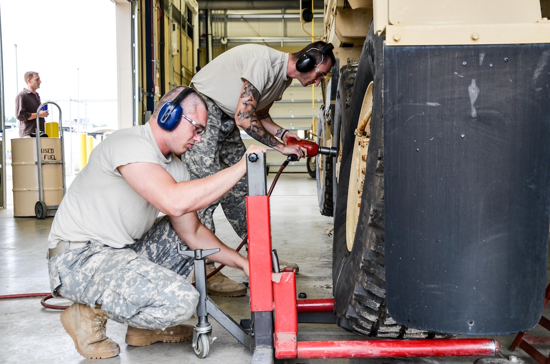 As part of their U.S. Army Reserve Annual Training participation in the 88th Regional Support Command’s Operation Platinum Support mission, , Pfc. Christian Kaplan (back) and Sgt. Bryant Vannoy (front) with the 298th Support Maintenance Company out of Altoona, Pa., remove the wheels of a FMTV for annual service and maintenance at the 88th RSC’s Equipment Concentration Site 67 on Fort McCoy, July 28. Operation Platinum Support allows Army Reserve Soldiers in low-density supply and maintenance specialties to perform and gain proficiency in their technical skills while acting in direct support to the numerous exercises taking place on Fort McCoy.