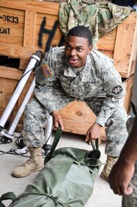 As part of their U.S. Army Reserve Annual Training participation in the 88th Regional Support Command's Operation Platinum Support mission, Soldiers from the 1015th Quartermaster out of Baltimore, Md., perform a two-person lift while stacking tentage before returning the equipment to storage at the 88th RSC’s Equipment Concentration Site 67 on Fort McCoy, July 28. Operation Platinum Support allows Army Reserve Soldiers in low-density supply and maintenance specialties to perform and gain proficiency in their technical skills while acting in direct support to the numerous exercises taking place on Fort McCoy.