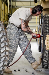 As part of his U.S. Army Reserve Annual Training participation in the 88th Regional Support Command’s Operation Platinum Support mission, Pfc. Christian Kaplan with the 298th Support Maintenance Company out of Altoona, Pa., removes the lug nuts from a FMTV to remove the wheels for annual service and maintenance at the 88th RSC’s Equipment Concentration Site 67 on Fort McCoy, July 28. Operation Platinum Support allows Army Reserve Soldiers in low-density supply and maintenance specialties to perform and gain proficiency in their technical skills while acting in direct support to the numerous exercises taking place on Fort McCoy.