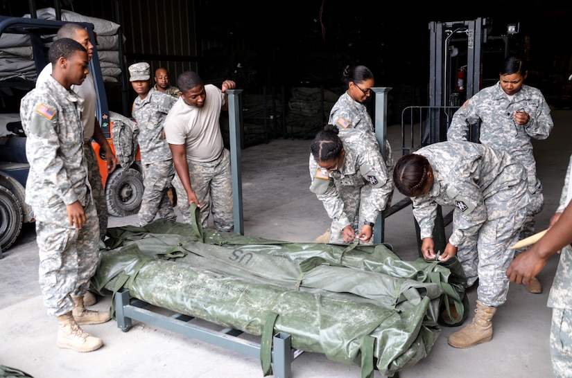 As part of their U.S. Army Reserve Annual Training participation in the 88th Regional Support Command's Operation Platinum Support mission, Soldiers from the 1015 Quartermaster out of Baltimore, Md., inspect the serviceability of tentage before returning the equipment to storage at the 88th RSC’s Equipment Concentration Site 67 on Fort McCoy, July 28. Operation Platinum Support allows Army Reserve Soldiers in low-density supply and maintenance specialties to perform and gain proficiency in their technical skills while acting in direct support to the numerous exercises taking place on Fort McCoy.