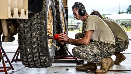 As part of their U.S. Army Reserve Annual Training participation in the 88th Regional Support Command's Operation Platinum Support mission, , Pfc. Christian Kaplan and Sgt. Bryant Vannoy with the 298th Support Maintenance Company out of Altoona, Pa., remove the wheels of a FMTV for annual service and maintenance at the 88th RSC’s Equipment Concentration Site 67 on Fort McCoy, July 28. Operation Platinum Support allows Army Reserve Soldiers in low-density supply and maintenance specialties to perform and gain proficiency in their technical skills while acting in direct support to the numerous exercises taking place on Fort McCoy.