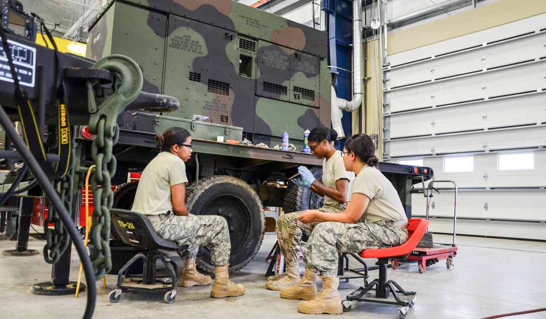 As part of their U.S. Army Reserve Annual Training participation in the 88th Regional Support Command's Operation Platinum Support mission, Spc. Kirsten Shavon Lee (left), Spc. Ashley Nicole Burks (center), and Pfc. Anita Sharma (right) with the 818th Support Maintenance Company out of Baltimore, Md., service the wheels on a portable generator at the 88th RSC’s Equipment Concentration Site 67 on Fort McCoy, July 28. Operation Platinum Support allows Army Reserve Soldiers in low-density supply and maintenance specialties to perform and gain proficiency in their technical skills while acting in direct support to the numerous exercises taking place on Fort McCoy.