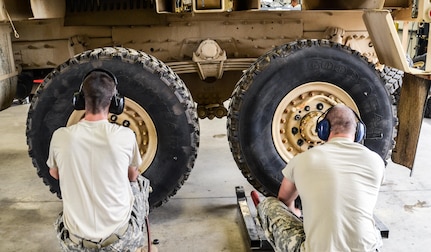 As part of their U.S. Army Reserve Annual Training participation in the 88th Regional Support Command's Operation Platinum Support mission, , Pfc. Christian Kaplan and Sgt. Bryant Vannoy with the 298th Support Maintenance Company out of Altoona, Pa., remove the wheels of a FMTV for annual service and maintenance at the 88th RSC’s Equipment Concentration Site 67 on Fort McCoy, July 28. Operation Platinum Support allows Army Reserve Soldiers in low-density supply and maintenance specialties to perform and gain proficiency in their technical skills while acting in direct support to the numerous exercises taking place on Fort McCoy.