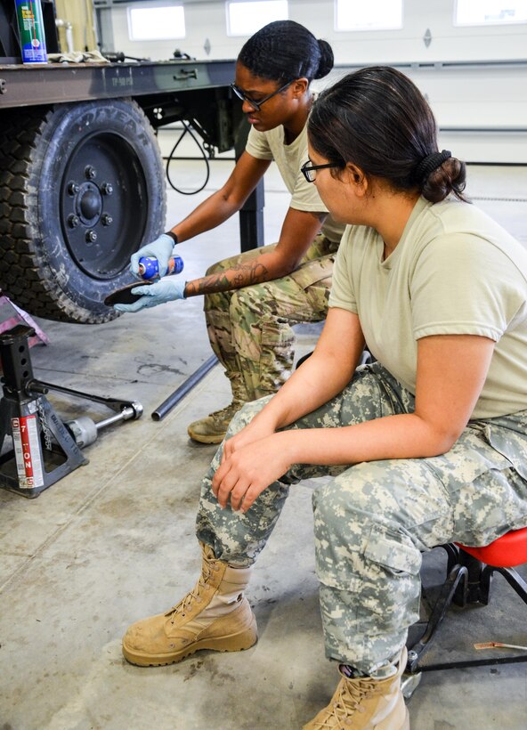 As part of their U.S. Army Reserve Annual Training participation in the 88th Regional Support Command's Operation Platinum Support mission, Spc. Ashley Nicole Burks (back), and Pfc. Anita Sharma (front) with the 818th Support Maintenance Company out of Baltimore, Md., service the wheels on a portable generator at the 88th RSC’s Equipment Concentration Site 67 on Fort McCoy, July 28. Operation Platinum Support allows Army Reserve Soldiers in low-density supply and maintenance specialties to perform and gain proficiency in their technical skills while acting in direct support to the numerous exercises taking place on Fort McCoy.