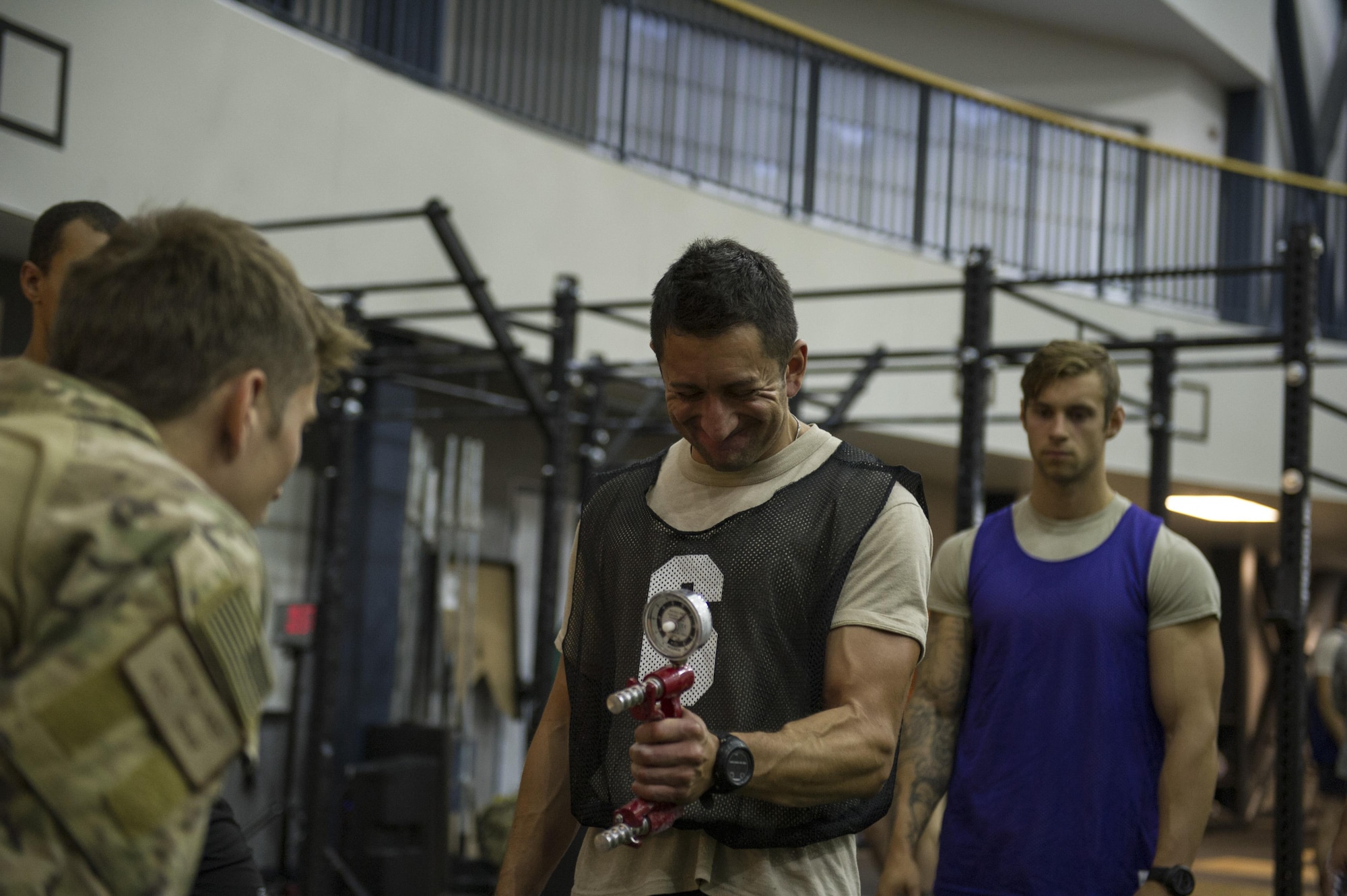 U.S. Air Force Staff Sgt. Kristopher Harpoon, 5th Air Support Operations Squadron, Joint Base Lewis-McChord, Wash., tactical air control party specialist, performs a grip strength test during a Battlefield Airman physical training (PT) test July 21, 2016, at Baker Field house on Eielson Air Force Base, Alaska. The last challenge of the competition was for competitors to complete a PT test. (U.S. Air Force photo by Airman Isaac Johnson)