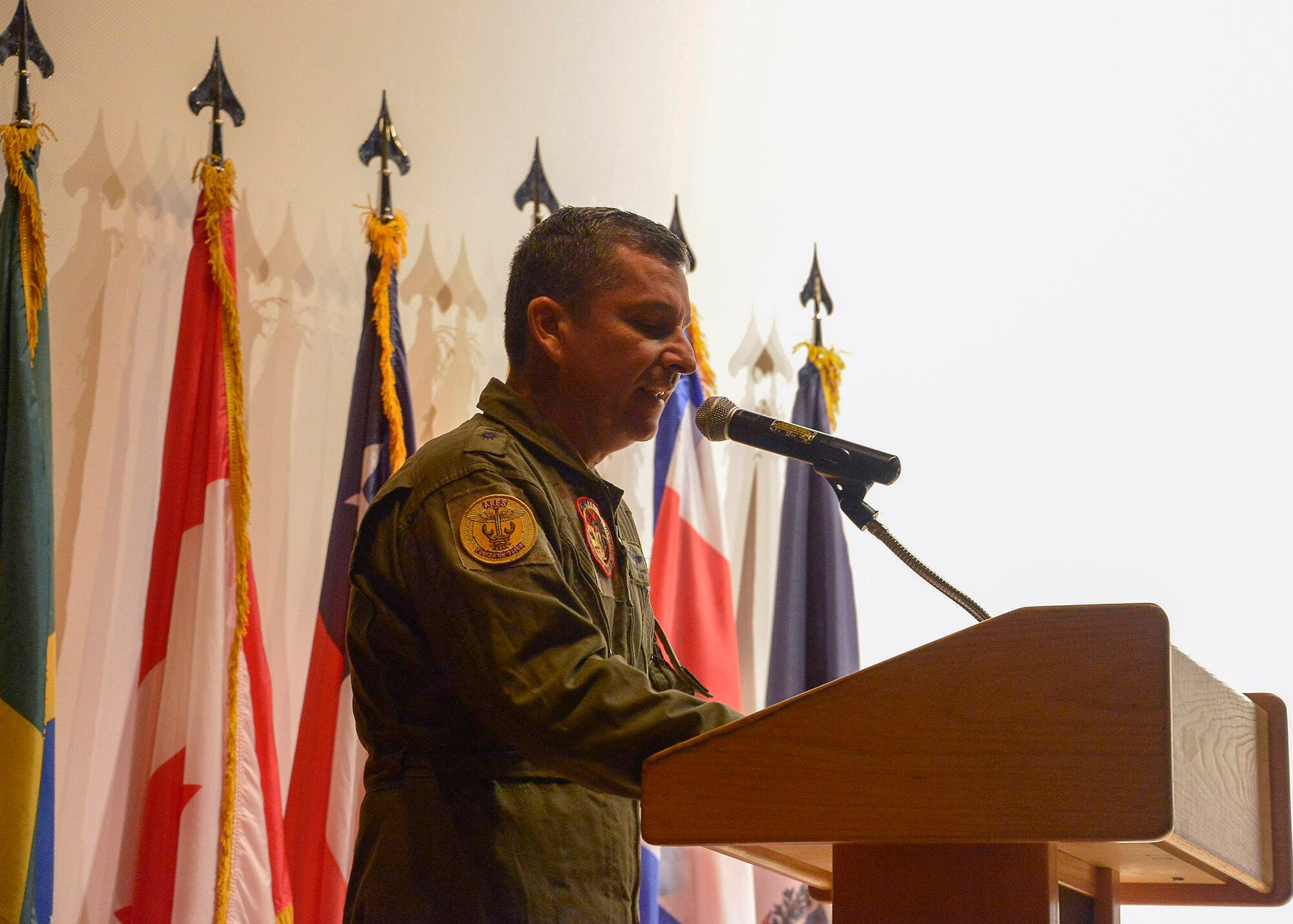 Colombian air force Brig. Gen. Sergio Andrés Garzón Vélez, PAMAMAX Combined Forces Air Component Commander, explains his expectations to the air forces participants for the upcoming PANAMAX Exercise at the base theater on Davis-Monthan AFB, Ariz., July 26, 2016. Nineteen total nations are joining the United States for a seven-day exercise that will use simulations to command and control multinational notional sea, air, cyber and land forces defending the vital waterway and surrounding areas against threats from violent extremism and to provide for humanitarian relief, as necessary. The PANAMAX exercise goal is to increase the ability of nations to work together, enable assembled forces to organize as a multination task force and test their responsiveness in combined operations. (U.S. Air Force photo by Tech. Sgt. Heather R. Redman)