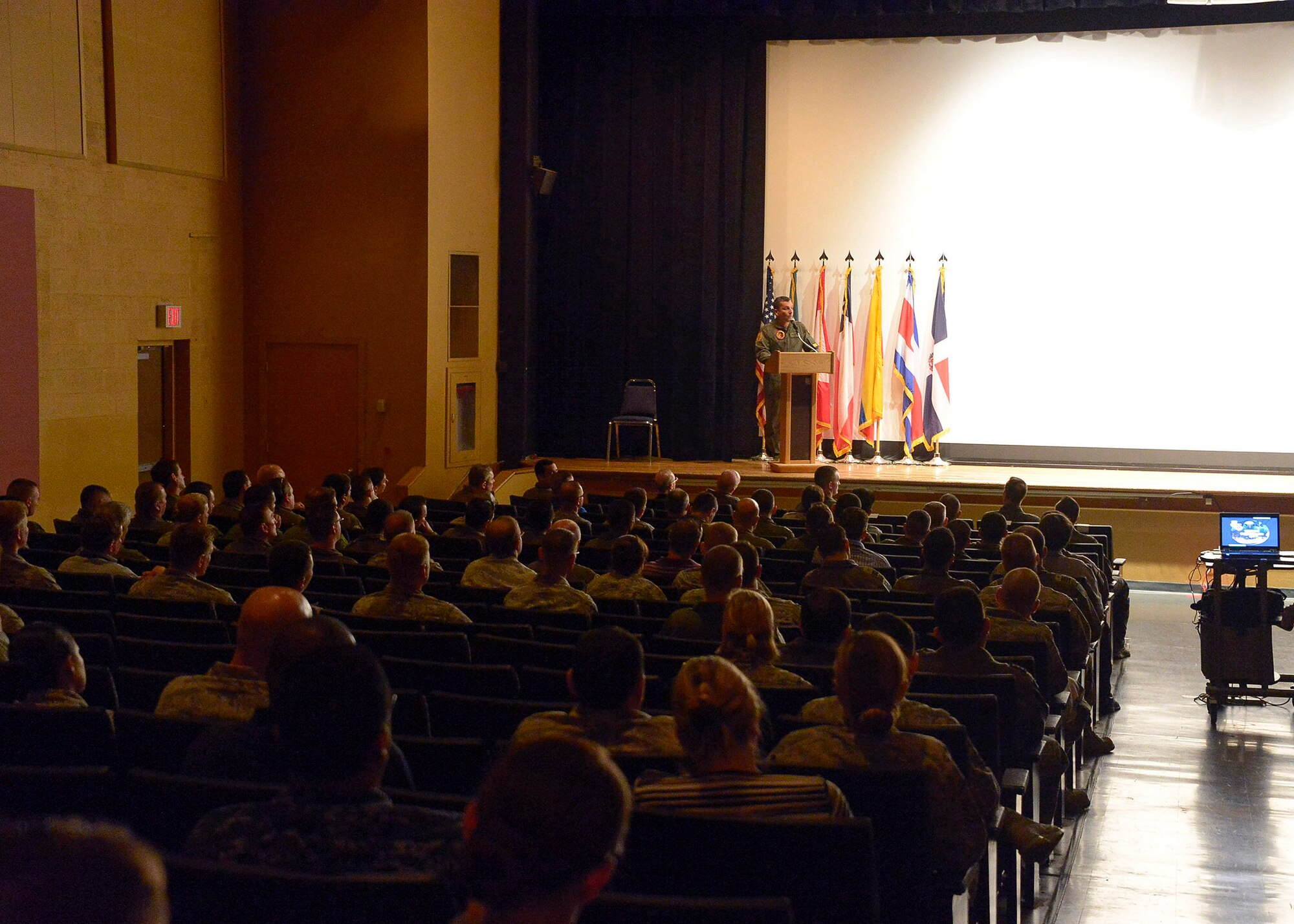 Colombian air force Brig. Gen. Sergio Andrés Garzón Vélez, PAMAMAX Combined Forces Air Component Commander, explains his expectations to the air forces participants for the upcoming PANAMAX Exercise at the base theater on Davis-Monthan AFB, Ariz., July 26, 2016. Nineteen total nations are joining the United States for a seven-day exercise that will use simulations to command and control multinational notional sea, air, cyber and land forces defending the vital waterway and surrounding areas against threats from violent extremism and to provide for humanitarian relief, as necessary. The PANAMAX exercise goal is to increase the ability of nations to work together, enable assembled forces to organize as a multination task force and test their responsiveness in combined operations. (U.S. Air Force photo by Tech. Sgt. Heather R. Redman)