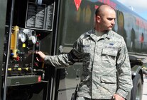 Senior Airman Roger Rosancrans, 5th Logistics Readiness Squadron fuels distribution operator, looks on as a B-52H Stratofortress is being fueled at Minot Air Force Base, N.D., July 28, 2016. Rosancrans helps fuel all the aircraft on Minot AFB. (U.S. Air Force photo/Senior Airman Kristoffer Kaubisch)