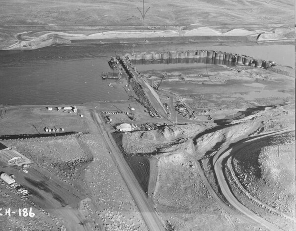 Ice Harbor Lock and Dam upstream of the Tri-Cities on the Lower Snake River celebrated its 50th anniversary of construction by the U.S. Army Corps of Engineers, June 16, 2012 at the dam. It was built from 1956 to 1962 and dedicated by Vice-President Lyndon B. Johnson on May 9, 1962. Corps of Engineers photos. (Looking NNW, south shore excavation)