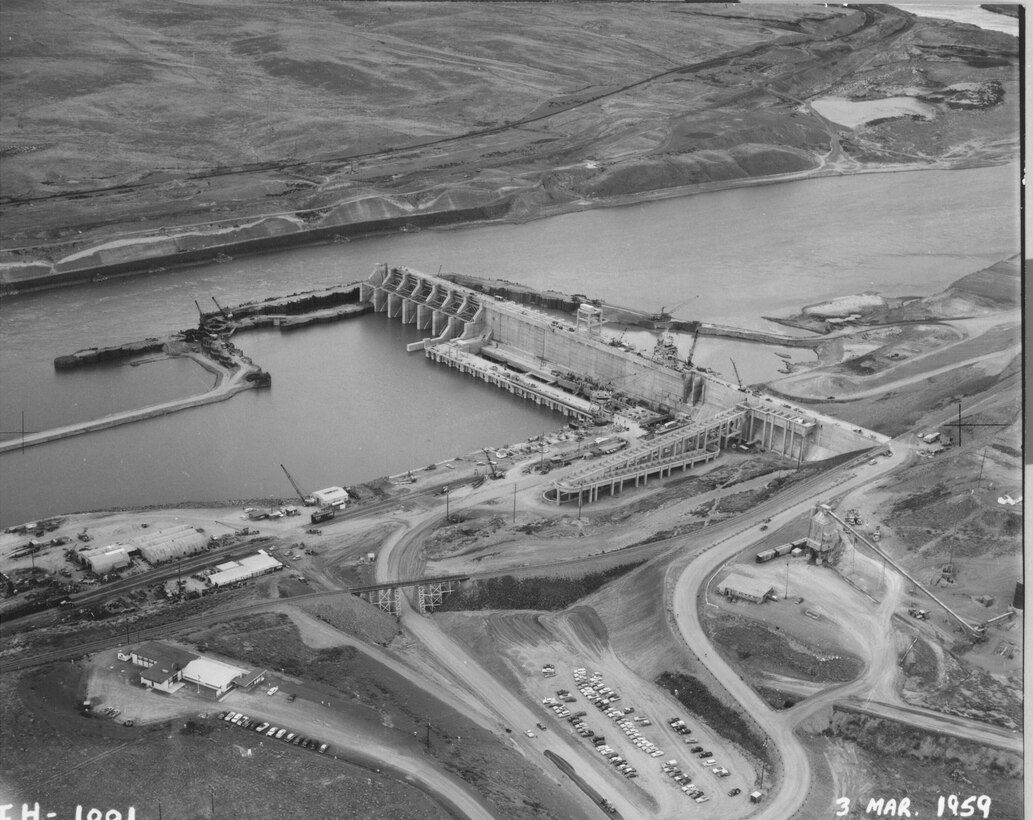Ice Harbor Lock and Dam upstream of the Tri-Cities on the Lower Snake River celebrated its 50th anniversary of construction by the U.S. Army Corps of Engineers, June 16, 2012 at the dam. It was built from 1956 to 1962 and dedicated by Vice-President Lyndon B. Johnson on May 9, 1962. Corps of Engineers photos. (Looking NE at South shore construction)