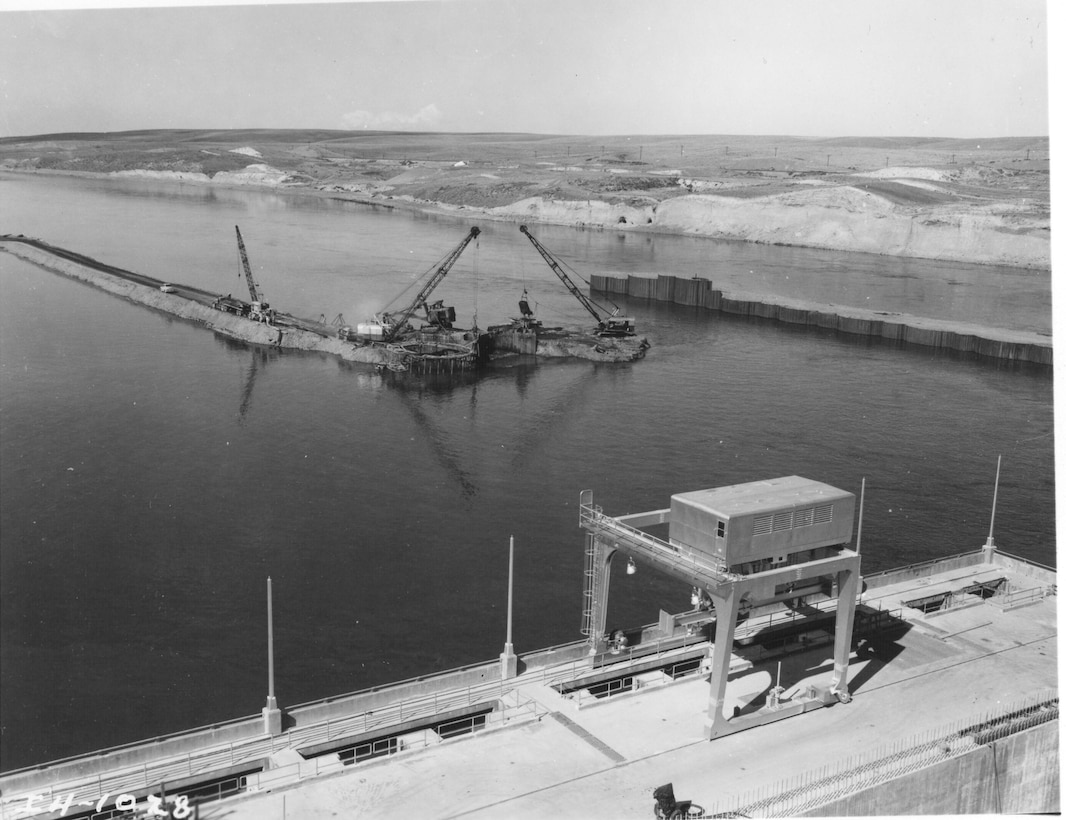 Ice Harbor Lock and Dam upstream of the Tri-Cities on the Lower Snake River celebrated its 50th anniversary of construction by the U.S. Army Corps of Engineers, June 16, 2012 at the dam. It was built from 1956 to 1962 and dedicated by Vice-President Lyndon B. Johnson on May 9, 1962. Corps of Engineers photos. (Removing cofferdam, looking NW)