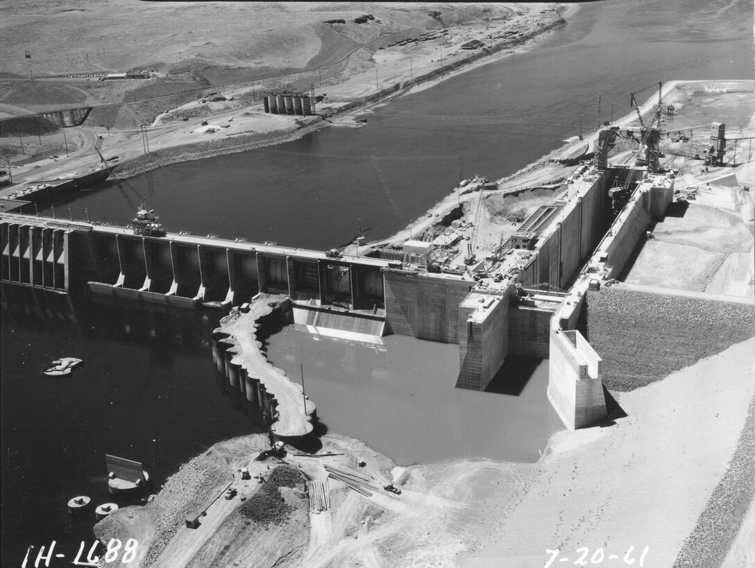 Ice Harbor Lock and Dam upstream of the Tri-Cities on the Lower Snake River celebrated its 50th anniversary of construction by the U.S. Army Corps of Engineers, June 16, 2012 at the dam. It was built from 1956 to 1962 and dedicated by Vice-President Lyndon B. Johnson on May 9, 1962. Corps of Engineers photos. (Looking downstream, lock and spillway)