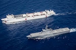 JS Shimokita (LST-4002) steams alongside hospital ship USNS Mercy (T-AH 19) while transiting to the third mission stop of Pacific Partnership 2016 in Da Nang, Vietnam. Upon arrival, partner nations will work side-by-side with local military and non-government organizations to conduct cooperative health engagements, community relation events and subject matter expert exchanges to better prepare for a natural disaster or crisis. 