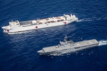 JS Shimokita (LST-4002) steams alongside hospital ship USNS Mercy (T-AH 19) while transiting to the third mission stop of Pacific Partnership 2016 in Da Nang, Vietnam. Upon arrival, partner nations will work side-by-side with local military and non-government organizations to conduct cooperative health engagements, community relation events and subject matter expert exchanges to better prepare for a natural disaster or crisis. 