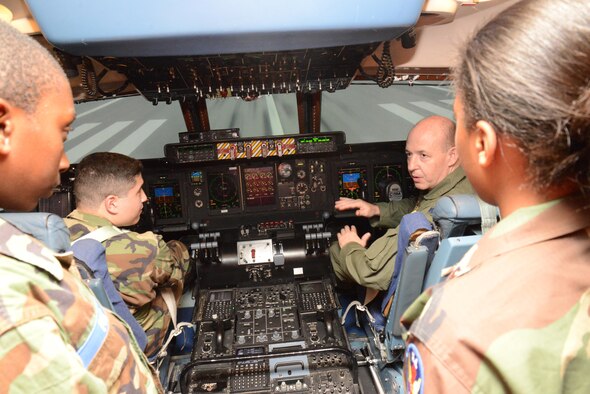 Lt. Col. Frederick McMahon, right, 433rd Airlift Wing pilot, instructs Civil Air Patrol Staff Sgt. Carlos Reyes and other CAP cadets just prior to takeoff in a C-5 Galaxy Flight Simulator July 18, 2016 at the 733rd Training Squadron, Joint Base San Antonio-Lackland, Texas. (U.S. Air Force photo/Minnie Jones)