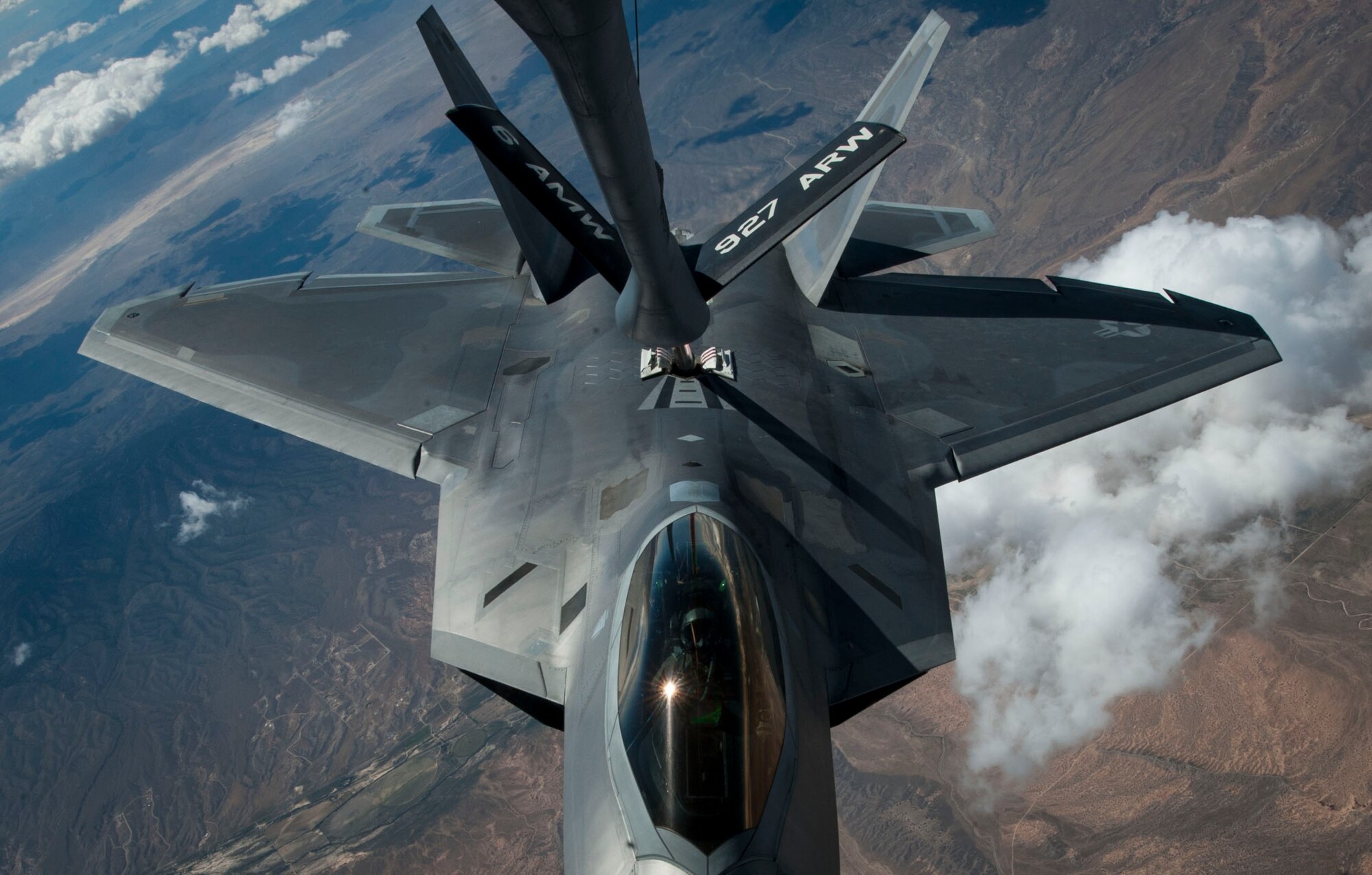 An F-22 Raptor, from Joint Base Langley-Eustis, Va., receives fuel from a KC-135 Stratotanker over the Nevada Test and Training Range in a training sortie during Red Flag 16-3, July 21, 2016. Red Flag, which is conducted by the 414th Combat Training Squadron at Nellis AFB, is a realistic combat training exercise involving the air forces of the U.S. and its allies that maximizes the combat readiness and survivability of participants by providing a realistic training environment. (U.S. Air Force photo by Senior Airman Jake Carter/Released)