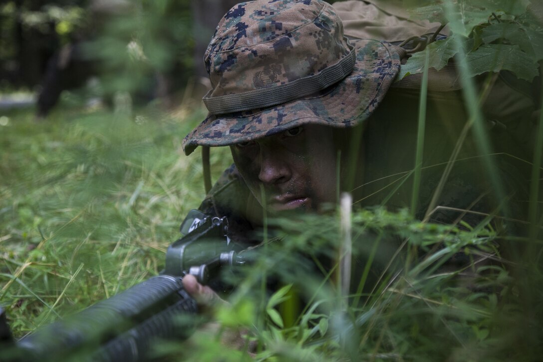 A Candidate with Delta Company, Officer Candidate School (OCS), conducts the Small Unit Leader Evaluation 2 aboard Marine Corps Base Quantico, Va., July 22, 2016. The mission of OCS is to educate and train officer candidates in order to evaluate and screen individuals for qualities required for commissioning as a Marine Corps officer. (U.S. Marine Corps Combat Camera photo by Lance Cpl. Jose Villalobosrocha/Released)